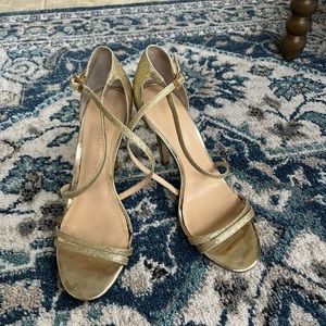 Gold sparkly heels in size 8.5.